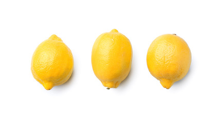 Whole ripe lemons on white background