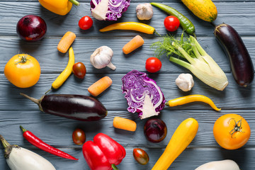 Flat lay composition with fresh vegetables on wooden background