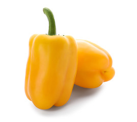 Fresh yellow peppers on white background