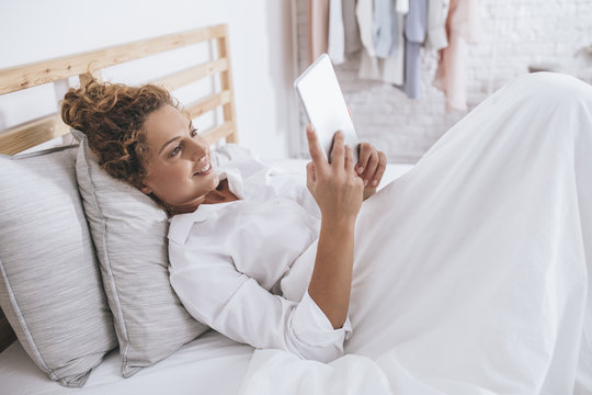 Woman Enjoying Morning in Her Bed