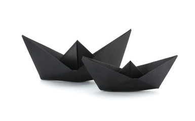 Origami boats on white background