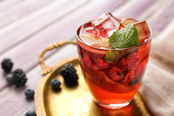 Fresh summer cocktail in glass on metal tray