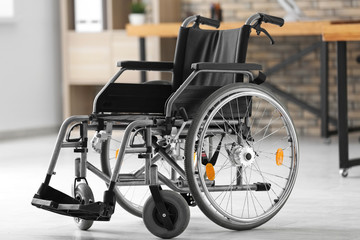Fototapeta na wymiar Empty modern wheelchair in room