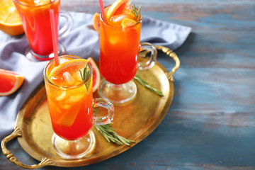 Fresh summer cocktail in glass cups on metal tray
