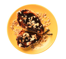 Plate with tasty baked pears and chocolate sauce on white background