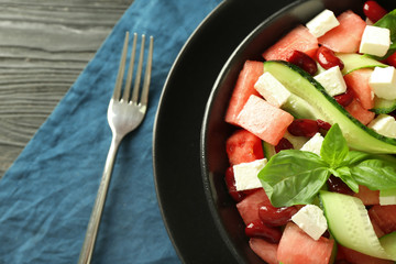 Plate with delicious watermelon salad on table, closeup