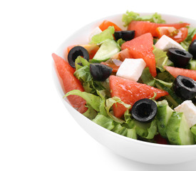 Bowl with delicious watermelon salad on white background, closeup