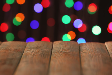 Closeup view of wooden table with glowing lights