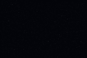 Dark starry sky, night background. Closeup moon and star light effect. Glow stars at dark blue space