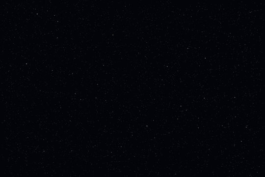 Dark starry sky, night background. Closeup moon and star light effect. Glow stars at dark blue space