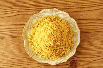 traditional indian gujrati tea time snack food namkeen sev or vermicelli fry noodles of chickpea flour or besan