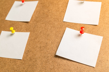 white stickers for notes on a cardboard background
