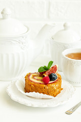 a piece of carrot cake with berries.