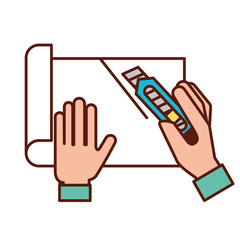 graphic designer hands cutting a paper