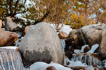 Winter waterfalls flowing over rocks