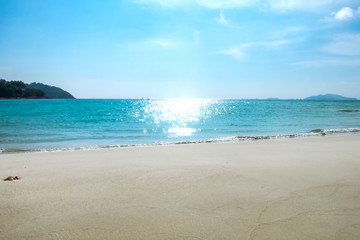Fototapeta na wymiar Blue sea and white sand in summer