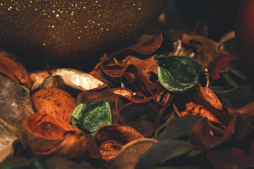 Close-up of christmas baubles and decorations, warm winter colors, toned studio image