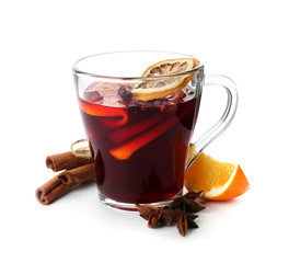 Glass cup of delicious mulled wine on white background