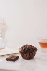 Breakfast with fresh homemade delicious muffins and tea.
