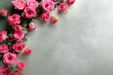Fototapeta na wymiar Composition with beautiful flowers on grey background