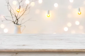 Foto op Canvas Wooden table in front of blurred abstract winter holiday background © didecs