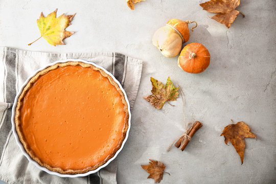 Baking Dish With Tasty Pumpkin Pie On Table, Top View