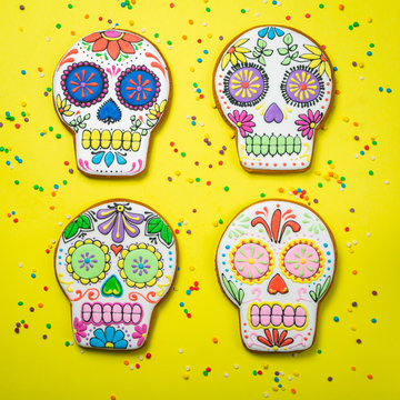 Dia de los muertos concept - skull shaped cookies with colorful decorations, top view