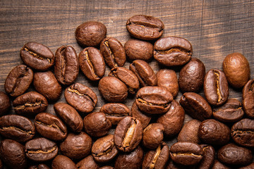 coffee beans on wooden background and empty space