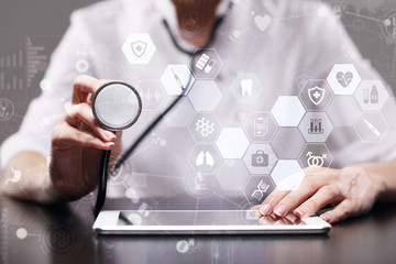 Medicine doctor is using modern computer virtual screen interface, medical technology network concept. EHP, EMR, Electronic health record.