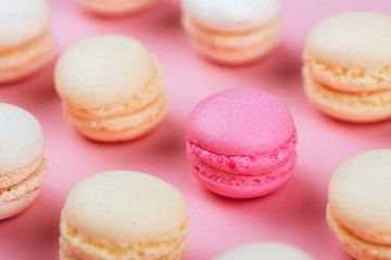 Macaroons in a pink background.