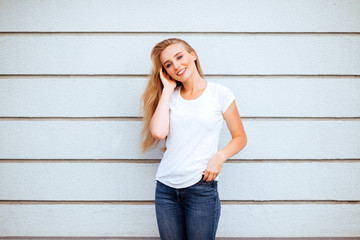 Beautiful girl in white t-shirt with long and beautiful hair