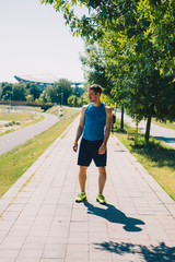 Man prepare to running on a track in a sunny day