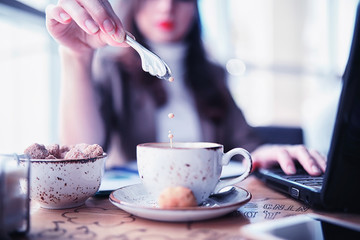 Girl eating coffee cakes