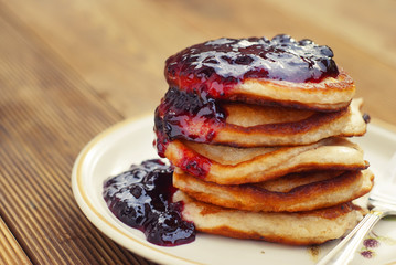 Homemade Breakfast, pancakeswith fruit jam, on wooden table. Pastry food. Dessert for kids.