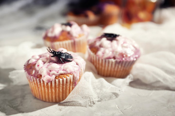 Creative cupcakes prepared for Halloween party on table