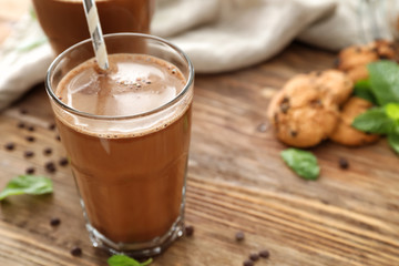 Glass of hot chocolate on wooden table