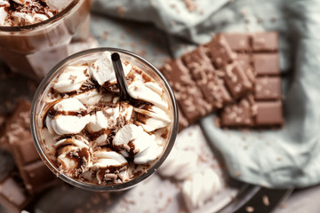 Glasses of hot chocolate with marshmallows on tray, closeup