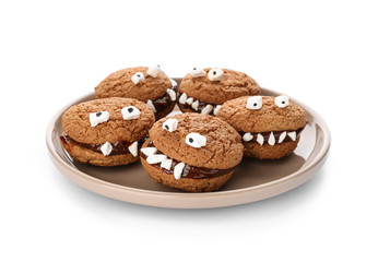 Plate with creative cookies prepared for Halloween party on white background