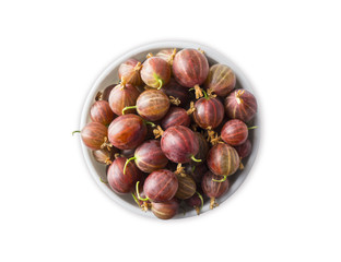 Top view. Gooseberries fruits isolated on white background. Red gooseberries in a bowl with copy space for text. Ripe gooseberry close-up. Background berry. Sweet and juicy berry.