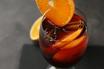 Glass of delicious mulled wine, closeup
