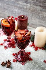 Glasses of delicious mulled wine on table