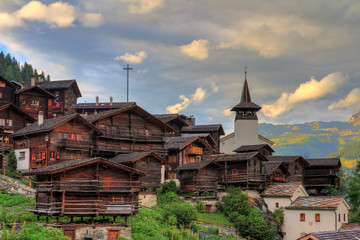 Beautiful cityscape of the alpine village Grimentz, Switzerland, with traditional wooden houses and...