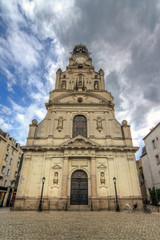 Fototapeta na wymiar Beautiful wide angle view of the Église Sainte-Croix de Nantes in the city of Nantes, France, on a summer day with clouds