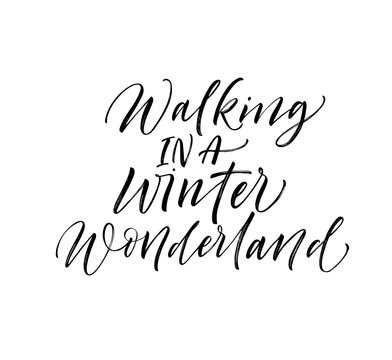 Walking in a winter wonderland card. Hand drawn vector modern calligraphy. Ink illustration. Happy holidays poster. 