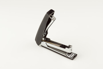 stapler for stapling papers on a table