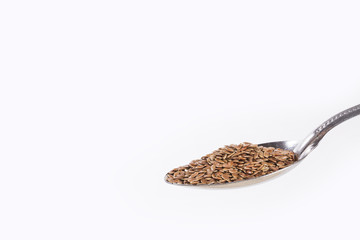 Organic seeds of flaxseed in the spoon