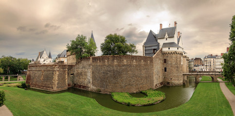 Beautiful panoramic cityscape view of The Château des ducs de Bretagne (Castle of the Dukes of Brittany) a large castle located in the city of Nantes, France © dennisvdwater
