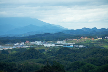 Fototapeta na wymiar Mountain peak range landscape. Green mountain range view. Mountain peak blue sky white clouds panorama