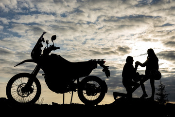 Fototapeta na wymiar romantic marriage proposal for motorcyclist