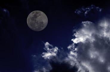 Naklejka na ściany i meble Attractive photo of super moon background night sky with cloudy and bright full moon. The moon were NOT furnished by NASA.